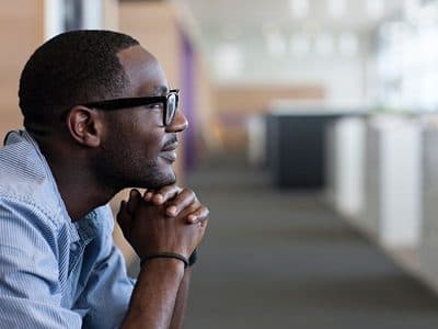 Man in deep contemplation, hand on chin